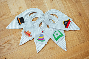Bibevie's range of bibs, with a lower level that clips into the dungarees.